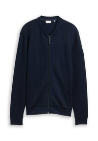 Giacca zip-up color navy realizzata in tessuto testurizzato con collo rotondo, tasche laterali e polsini e orlo a coste. Presenta una piccola patch con logo sulla manica.