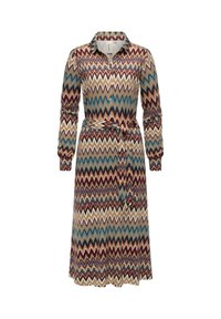 Sukienka w wzór z zygzakowatym motywem w kolorach czerwonym, niebieskim i kremowym. Długie rękawy, kołnierzyk, zapinana na guziki z przodu oraz pasek do wiązania w talii.