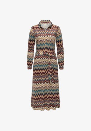 Mönstrad klänning med ett zickzackmönster i rött, blått och beige. Långa ärmar, krage, knappar fram och ett band i midjan.