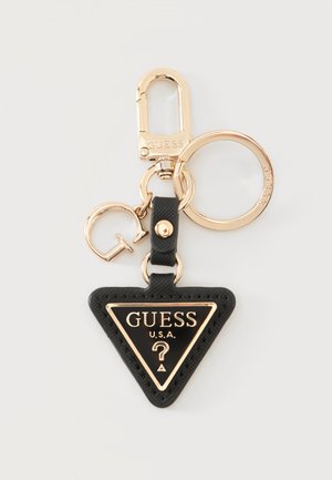 Μαύρο τριγωνικό μπρελόκ Guess με χρυσό περίγραμμα, κείμενο U.S.A., σύμβολο ερωτηματικού και χρυσό κρίκο και κλιπ για κλειδιά.