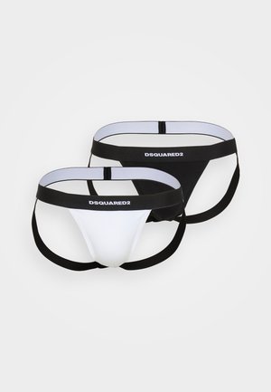Two pairs of men's thongs, one white and one black. Each features elastic waistbands with "DSQUARED2" logo and minimal coverage design.