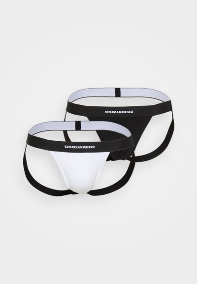 Zwei Paare von Männer-Thongs, eines in Weiß und eines in Schwarz. Jedes verfügt über elastische Taillenbänder mit dem "DSQUARED2"-Logo und einem minimalistischen Schnitt.