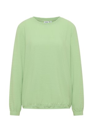 Light green long-sleeve top with a textured fabric, rounded neckline, and elasticized cuffs and hem. No prominent embellishments.