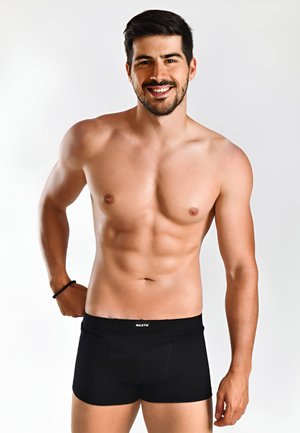 Schwarze Boxershorts mit einer engen Passform und weichem Material. Mit einem markierten Bund und standardmäßiger Beinlänge, ideal für den täglichen Gebrauch.