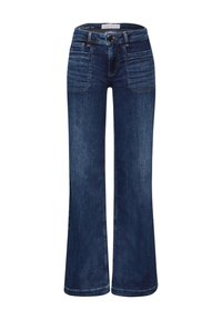 Mörkblå denimbyxor med utsvängd ben som har en medelhög midja, fem fickor och kontrasterande sömmar. Tyget har en mjuk yta.