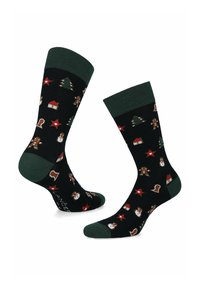 Czarne skarpetki z zielonymi mankietami, ozdobione świątecznym wzorem z choinkami, piernikowymi ludkami, bałwanami i czerwonymi gwiazdkami. Materiał mieszanka bawełny.