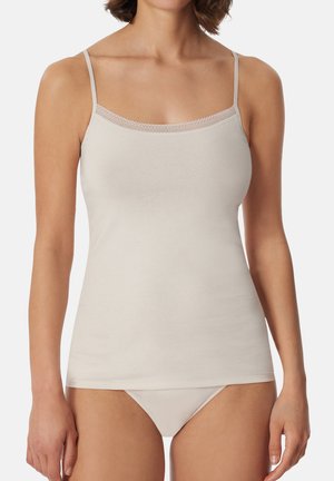 Beige camisole with thin straps, featuring a delicate lace trim along the neckline. Soft, smooth fabric, and fitted design.