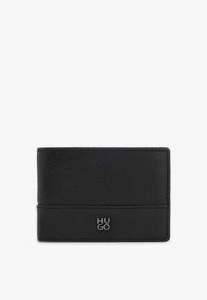Black leather wallet with textured surface, smooth bottom section, and embossed "HUGO" logo. Slim rectangular shape for cards and cash.