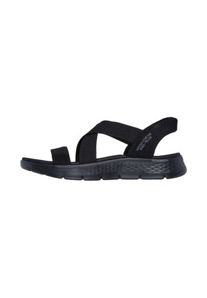 Black sandals with wide fabric straps, open toe design, and molded sole. Textured rubber outsole provides grip and stability.