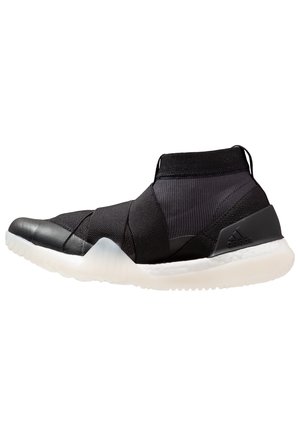 Sort højtop atletiksko med elastiske krydsstropper, strikket overdel, hvid polstret sål og Adidas-logo på hælstykket.
