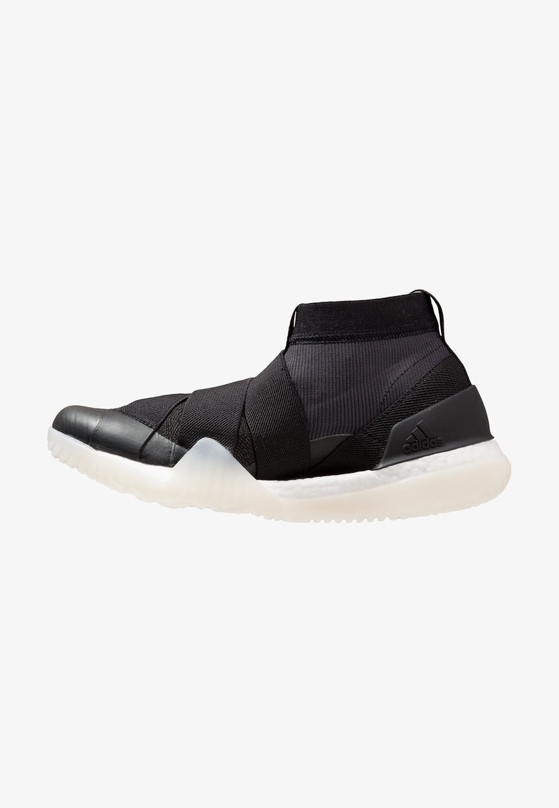 Baskets montantes noires avec brides croisées élastiques, tige en maille, semelle blanche amortissante et logo Adidas sur le contrefort du talon.