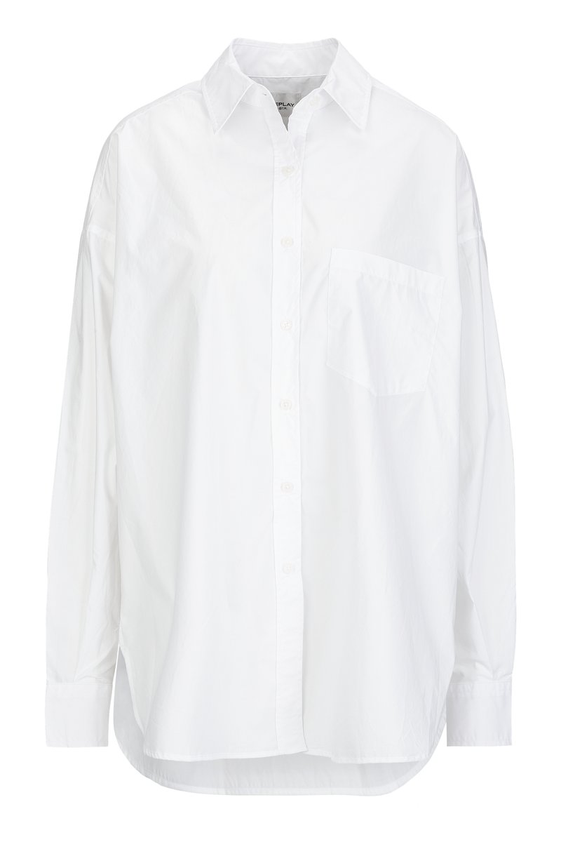 White long-sleeve button-up shirt made of cotton, featuring a classic collar, a single chest pocket, and a relaxed fit with a rounded hem.