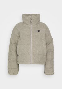 Veste zippée beige à texture polaire avec col montant et logo "HH" sur la poitrine gauche, dotée de manches longues et d'un design matelassé.