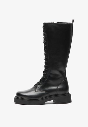 Black leather knee-high boots featuring a lace-up front, rounded toe, chunky rubber sole, and smooth finish.