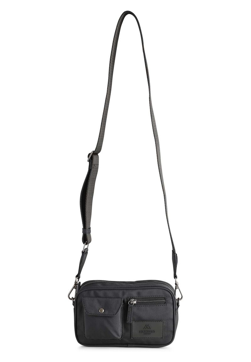 Compact black crossbody bag made of durable fabric, featuring two front pockets, adjustable strap, and a zippered main compartment.