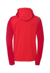 Rood gewatteerde jas met lange mouwen, gestructureerde achterkant en geometrisch patroon op de schouders. Voorzien van een ritssluiting aan de voorkant en elastische manchetten.