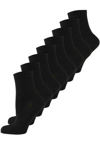 Schwarze Knöchelsocken, in einer Reihe angeordnet, mit geripptem Muster und verstärkter Spitze. Das Set enthält mehrere Paare.