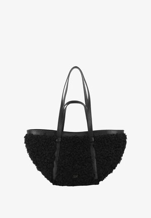 Black tote bag featuring a textured, fluffy fabric body and smooth leather handles. Designed in a crescent shape with a gold logo detail.