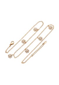 Collana in oro con ciondoli floreali e pietre trasparenti incastonate, texture liscia e chiusura a moschettone.