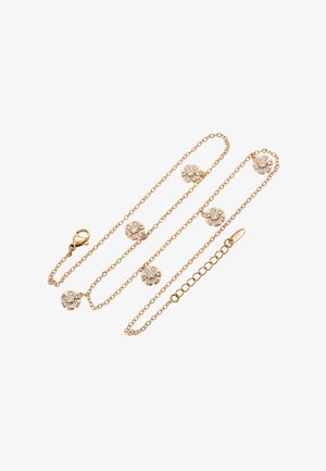 Gouden ketting met bloemencharms met ingelegde heldere stenen, gladde textuur en een sluiting met een kreeftsluiting.