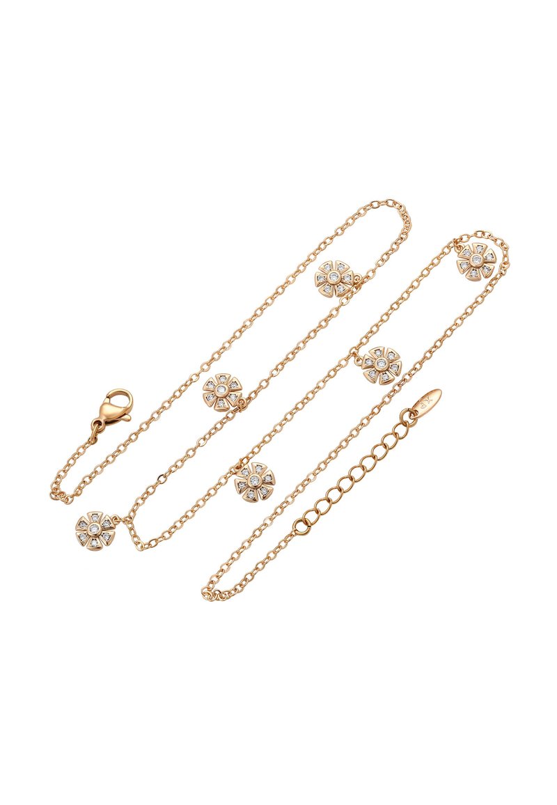 Collana in oro con ciondoli floreali e pietre trasparenti incastonate, texture liscia e chiusura a moschettone.
