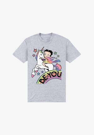 Szara koszulka z nadrukiem przedstawiającym dziewczynkę jeżdżącą na jednorożcu, z kolorowymi gwiazdami i tęczowym banerem "Bądź sobą".