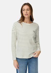 Lange mouwen gestreepte blouse in crème en olijf, met een ronde halslijn en geborduurde details op de borst. Zachte stof en een relaxte pasvorm.