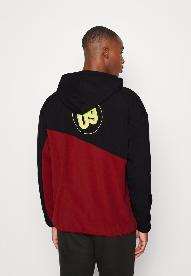 Puma BVB BORUSSIA DORTMUND WINTERIZED HOODY - Fleece jumper - intense  red/safety yellow/red - Zalando.de