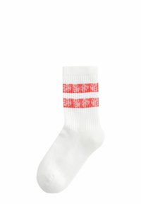 White ankle socks with ribbed texture and two horizontal coral stripes featuring a floral pattern. Classic, mid-calf length design.