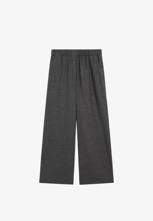 Pantalon large gris foncé avec taille élastique et poches latérales, confectionné dans un tissu doux pour un ajustement décontracté.