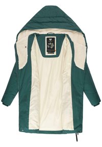 Ziloni puffer jaka ar brūnu vilnas oderi, pievienotu kapuci un ar rāvējslēdzēju aizdari. Iekšpusē ir melna etiķete.