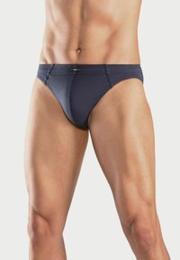 Marineblaue Herrenunterhosen aus weichem Material mit einer figurbetonten Passform, ausgestattet mit einem dezenten Logo am Bund und glatten Nähten.