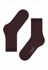 Dwie ciemno-brązowe wełniane skarpetki z żeberkowymi mankietami, z których jedna pokazuje spód z nadrukiem "FALKE COSY WOOL" w białym kolorze.