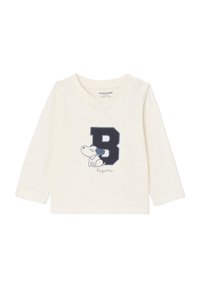 Helles langärmliges Baby-Shirt mit blauem "B" und einem Cartoon-Hund, beschriftet mit "Dogsitter". Druckknöpfe an der Schulter für einfaches Ankleiden.