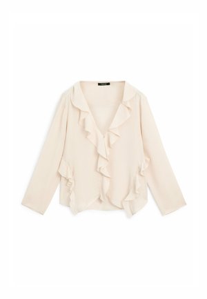 Blouse rose clair en tissu doux, avec un décolleté en V, des manches longues et des volants le long du col et des bords avant.