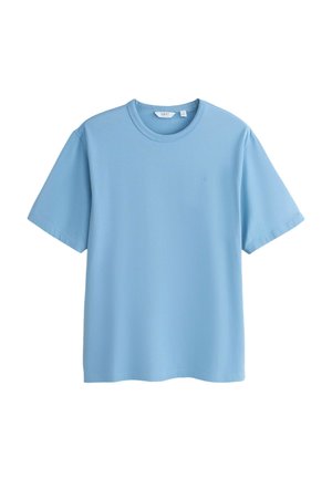 T-shirt bleu clair à manches courtes et col rond avec un petit logo brodé sur le côté gauche de la poitrine, présenté à plat sur un fond blanc.
