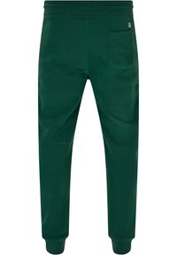 Donkergroene joggers van zachte stof, met een tapering leg ontwerp, elastische tailleband, ribgebreide boorden en een enkele achterzak.