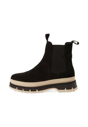 Black suede Chelsea boot with elastic side panels, beige and black rugged sole, and pull tabs at front and back.