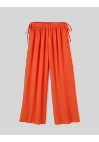 Pantalon large orange vif avec taille élastique et liens ajustables sur les côtés, présenté sur un fond gris.
