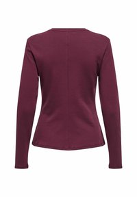 Langsleeve top in bordeaux, gemaakt van gladde stof. Heeft een ronde halslijn en een aansluitende silhoeët met een naad in het midden van de achterkant.