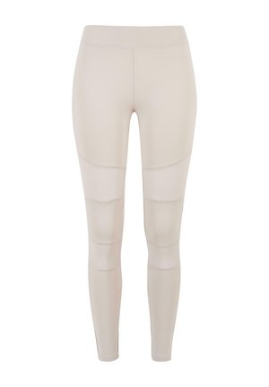 Beezhijad retuusid, mis on valmistatud venivast materjalist ja millel on tekstureeritud aktsendid ning lai vöökoht mugavuse tagamiseks.