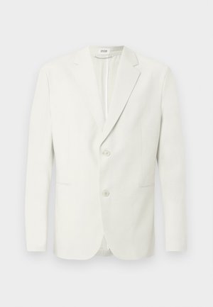 Hvid blazer lavet af letvægtsstof, med en jakke med hakket revers, to knapper og to sidelommer med diskrete syningsdetaljer.