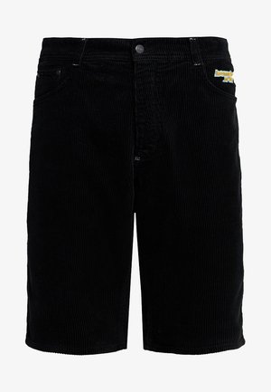 Sorte kordfløyelsbukser med klassisk passform, med en metallknapp, fem lommer, og subtilt gult broderi på frontlommen.