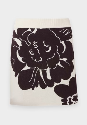 Strikket skjørt med en kremfarget bakgrunn og store svarte blomsterdesign, bred midje og rett silhuett.