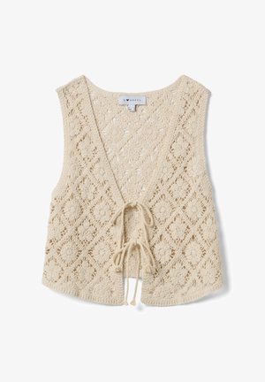 Cream crochet vest with floral pattern and two front ties, sleeveless design and V-neckline.
