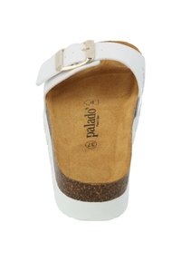 White slip-on sandal with a cork footbed. Features a metal buckle and soft suede texture. Non-slip sole with a light, casual design.