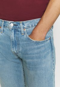 Levi's® 502™ TAPER - Calças de ganga de corte afunilado - light-blue denim