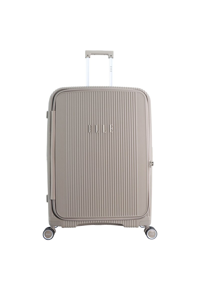 Hard-shell suitcase in light beige, featuring vertical ribbed texture, a retractable handle, four spinner wheels, and logo detail.