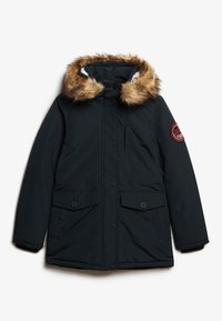 Navy padded jacket with a faux fur-lined hood, front buttons, and two large pockets. Features a red logo patch on the sleeve.