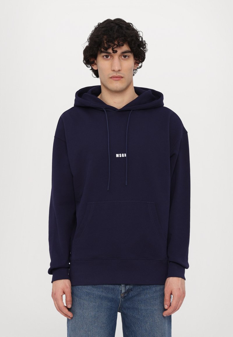 Navy blue hoodie made of soft fabric, featuring a front kangaroo pocket and logo print in white. Relaxed fit with drawstring hood.